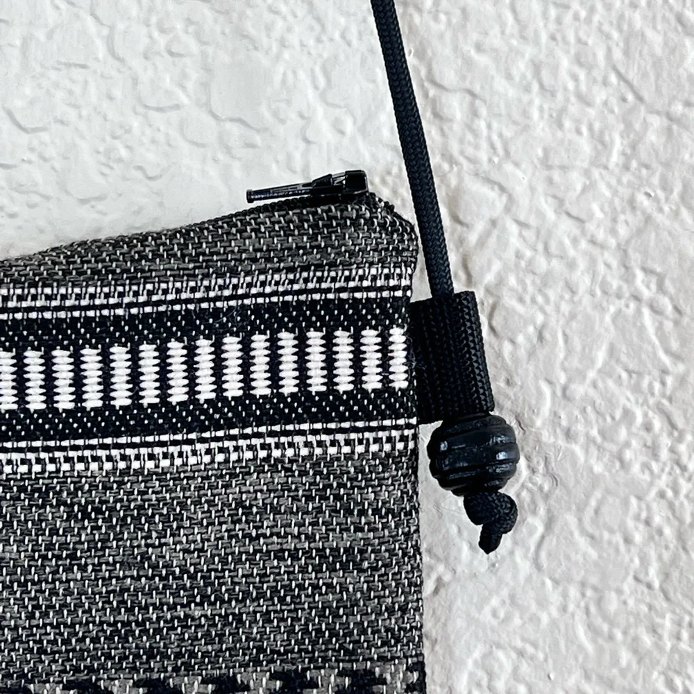 Like new black and white woven crossbody bag small
